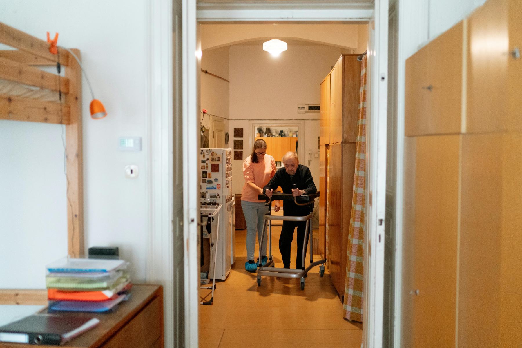 Carer supporting an older adult at home